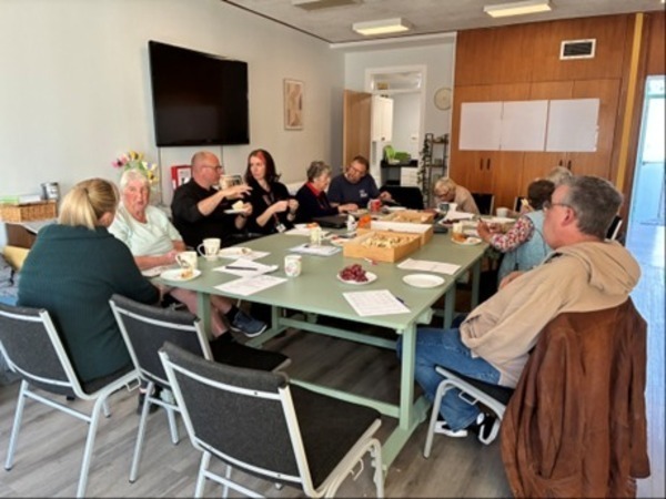 Group of people sitting around a table